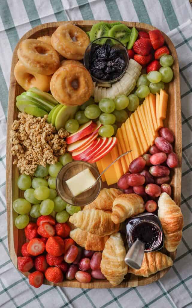 Brunch Charcuterie Board with fruit, donuts and croissants and cheese