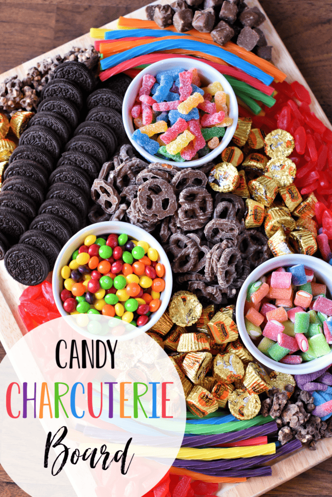 Kids Candy Charcuterie Board with colorful candies and chocolate covered pretzels and Oreo cookies