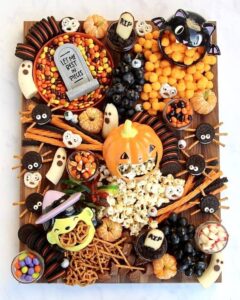 Halloween Snack Board Idea with cookie spiders and banana ghosts