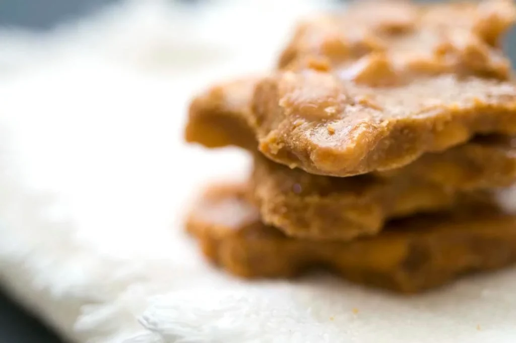 Homemade Southern peanut brittle made with a Dr Pepper glaze