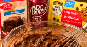 dr pepper and brownie mix and chocolate chips in a bowl