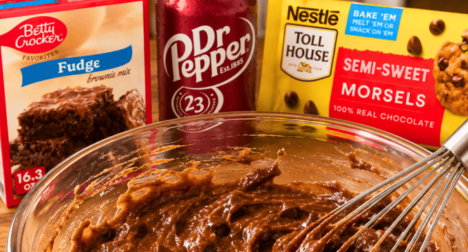 dr pepper and brownie mix and chocolate chips in a bowl
