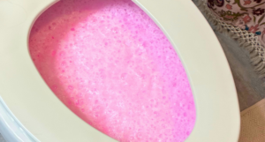 bubbly pink toilet cleaner in toilet bowl