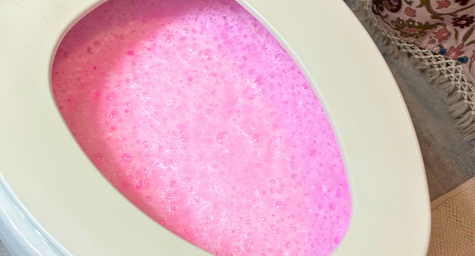 bubbly pink toilet cleaner in toilet bowl